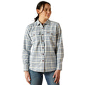 Woman wearing a plaid shirt on a white background