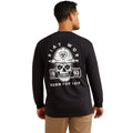 Man wearing a black long-sleeve shirt with a skull and hard hat graphic on the back.