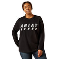 Person wearing a black Ariat long-sleeve shirt on a white background