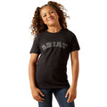 Young girl wearing a black t-shirt with text on a white background