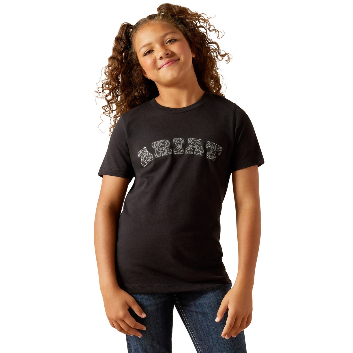 Young girl wearing a black t-shirt with text on a white background