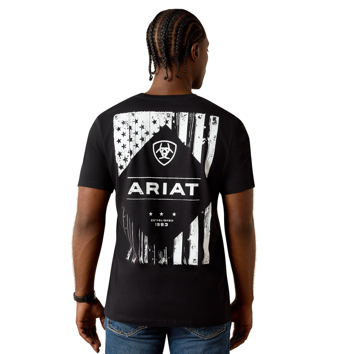 Person wearing a black t-shirt with a white graphic design and 'Ariat' branding on the back.
