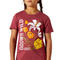 Child wearing a maroon t-shirt with floral design and 'Grown Wild Ariat' text.