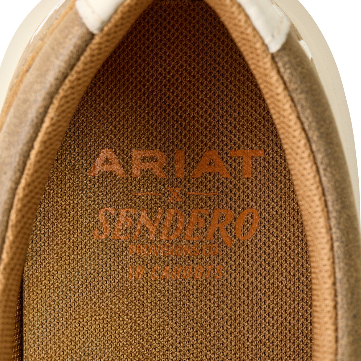 Close-up of Ariat Sendero logo on brown textured material
