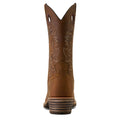 Brown cowboy boot with intricate stitching on a white background