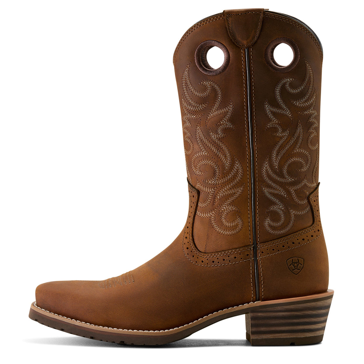 Brown cowboy boot with intricate stitching on a white background