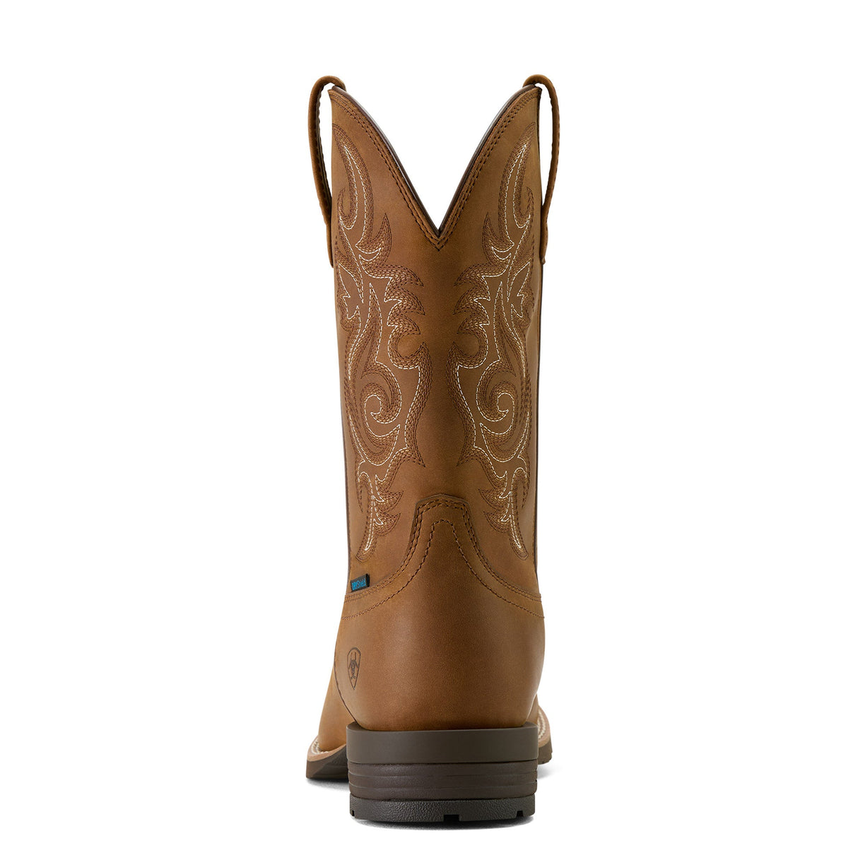 Brown cowboy boot with intricate embossing on a white background