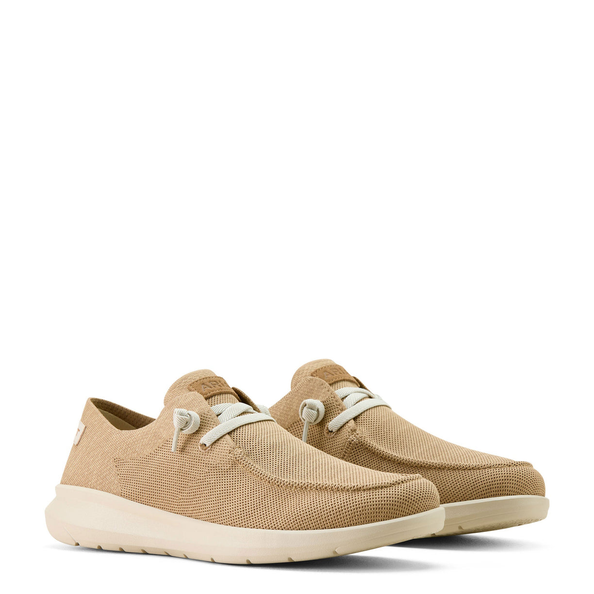 Pair of tan casual shoes with white laces on a white background