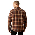 Man wearing a brown plaid shirt on a white background