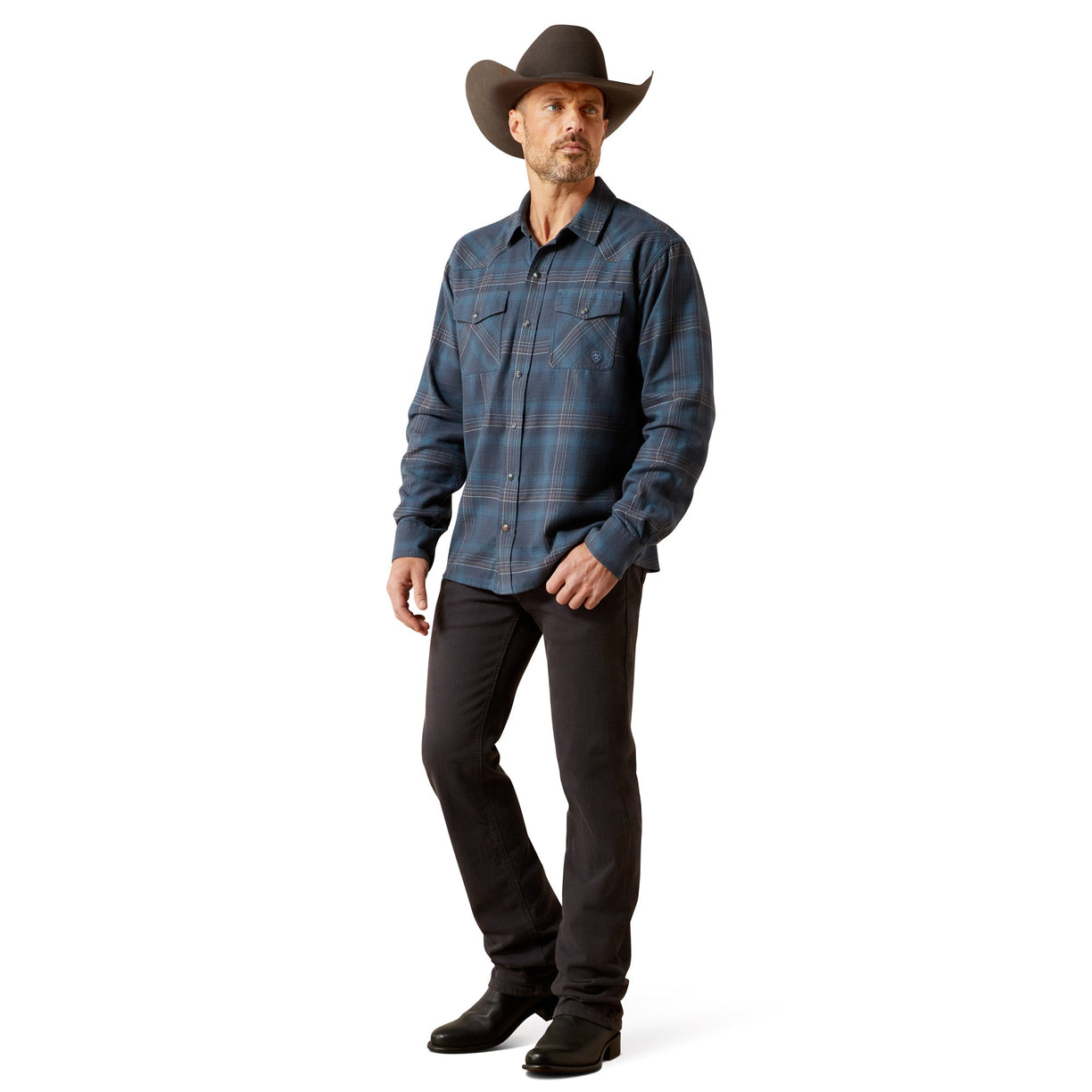 Man wearing a blue plaid shirt, black pants, and a cowboy hat on a white background