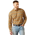 Man wearing a patterned shirt and jeans on a white background