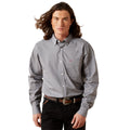 Man wearing a patterned gray shirt on a white background