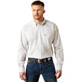 Man wearing a light gray patterned shirt and blue jeans on a white background
