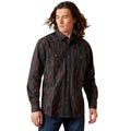 Man wearing a patterned shirt on a white background