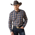 Man wearing a plaid shirt, jeans, and a cowboy hat on a white background