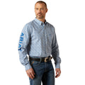 Man wearing a blue patterned Ariat shirt on a white background