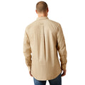 Man wearing a beige patterned shirt on a white background
