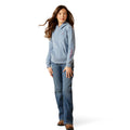 Person wearing a blue hoodie and jeans on a white background