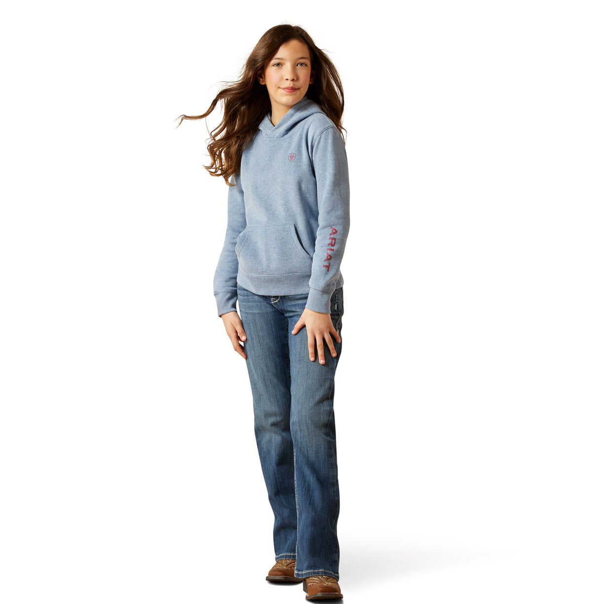 Person wearing a blue hoodie and jeans on a white background