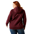 Person wearing a maroon hoodie on a white background