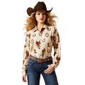 Woman wearing a cowboy-themed shirt with horse and boot patterns, jeans, and a brown cowboy hat on a white background.