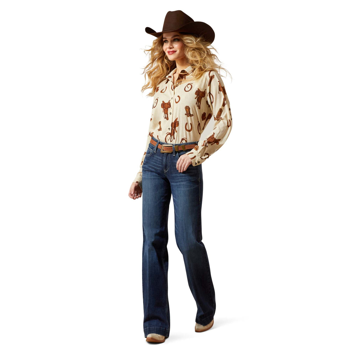 Woman wearing a cowboy hat, patterned shirt, and jeans on a white background