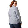 Woman wearing a blue and white striped shirt on a white background