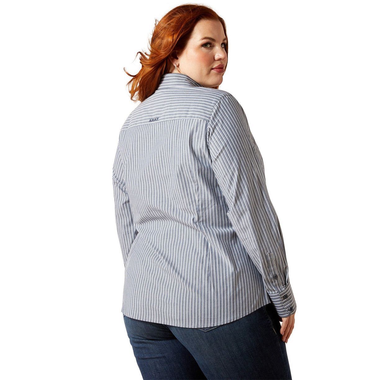 Woman wearing a blue and white striped shirt on a white background