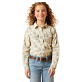 Young girl wearing a patterned shirt and jeans on a white background