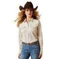 Woman wearing a beige shirt, blue jeans, and a brown cowboy hat on a white background