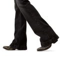 Black jeans and brown boots on a white background