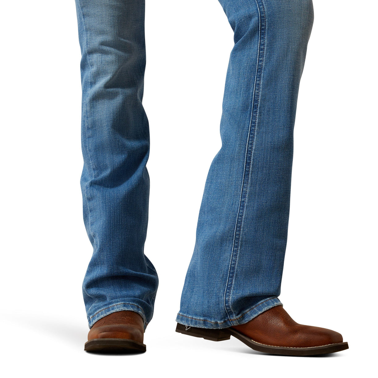 Blue jeans and brown boots on a white background