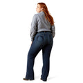 Woman wearing blue jeans and a striped shirt on a white background