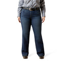 Person wearing blue jeans and a striped shirt on a white background