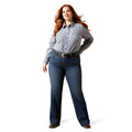 Woman wearing a checkered shirt and blue jeans on a white background