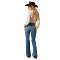 Woman wearing a cowboy hat, white shirt, and blue jeans on a white background