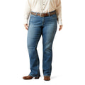 Plus size wearing blue jeans and a beige shirt on a white background