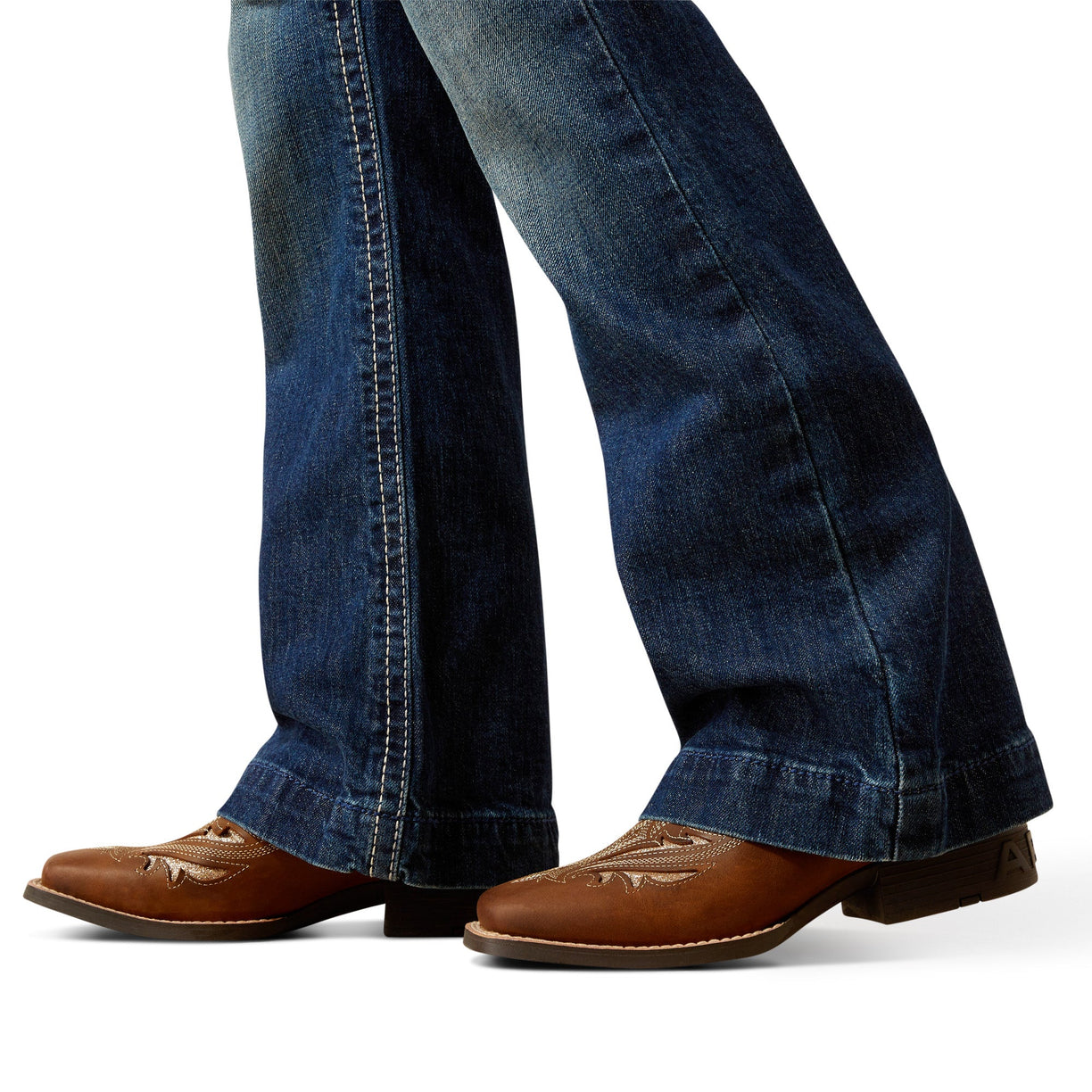 Blue jeans with brown shoes on a white background