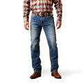 Person wearing blue jeans and a plaid shirt on a white background