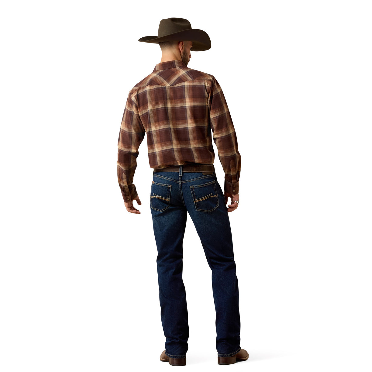 Man wearing a brown plaid shirt and blue jeans with a cowboy hat on a white background