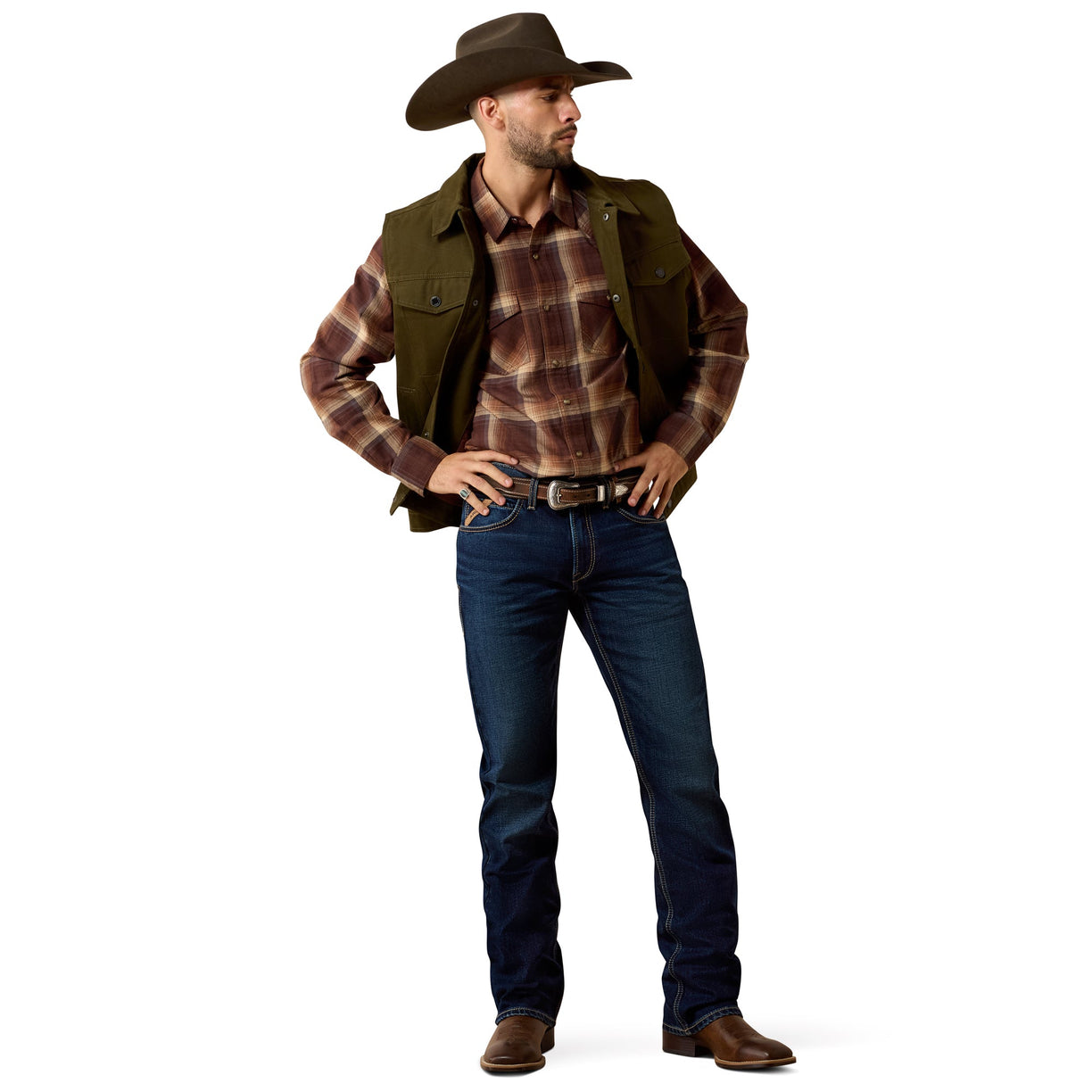 Man wearing a cowboy hat, plaid shirt, vest, and jeans on a white background