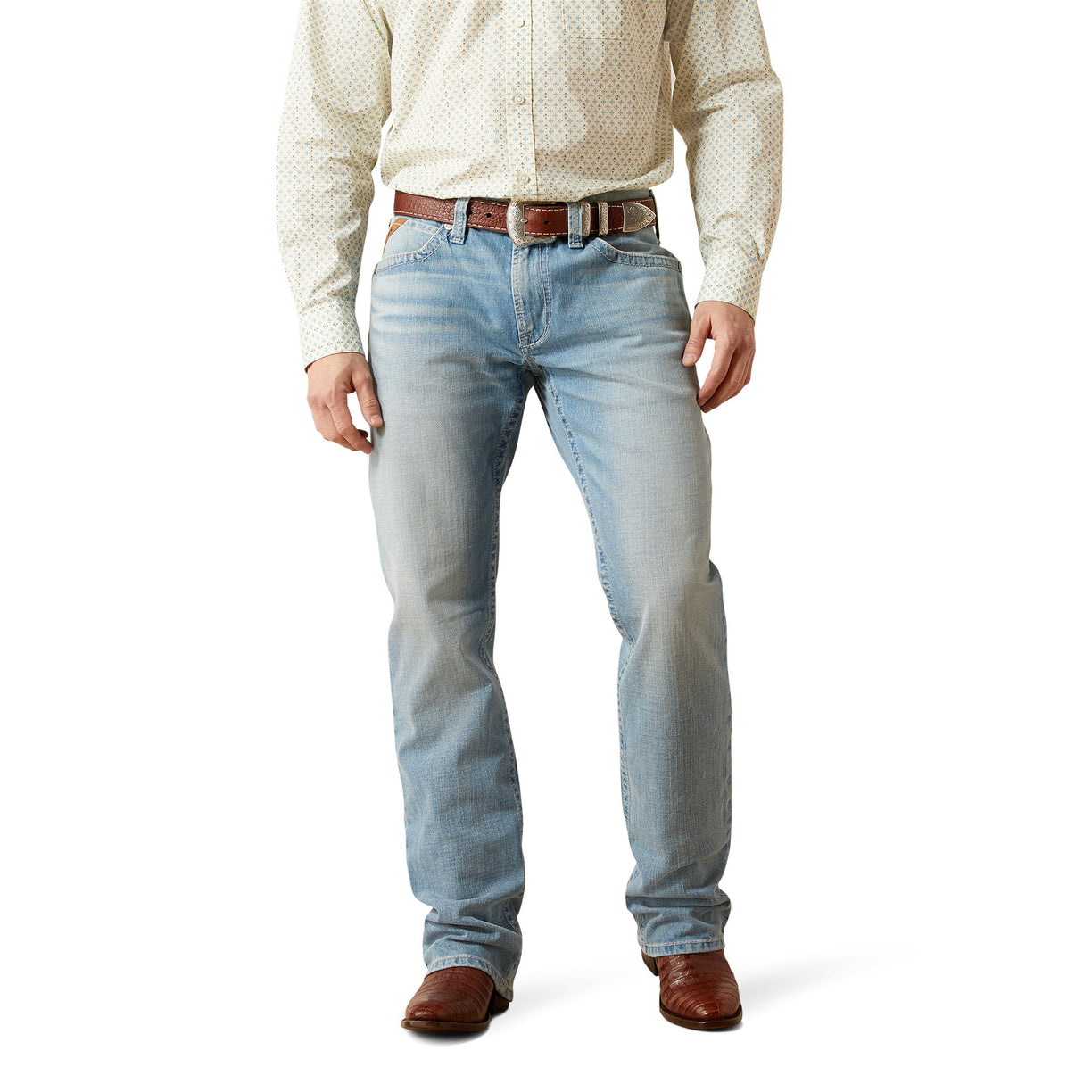 Person wearing light wash blue jeans and a patterned shirt on a white background, workwear, casual jeans. 