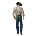 Man wearing a checkered shirt, blue jeans, and a cowboy hat on a white background