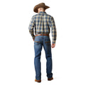 Man wearing a plaid shirt and jeans with a cowboy hat on a white background