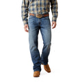 Person wearing a plaid shirt, workwear, outback, jeans, and brown boots on a white background, cotton, straight leg. 