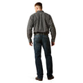 Man wearing a checkered shirt and jeans on a white background