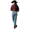 Person wearing a maroon shirt, blue jeans, and a cowboy hat on a white background