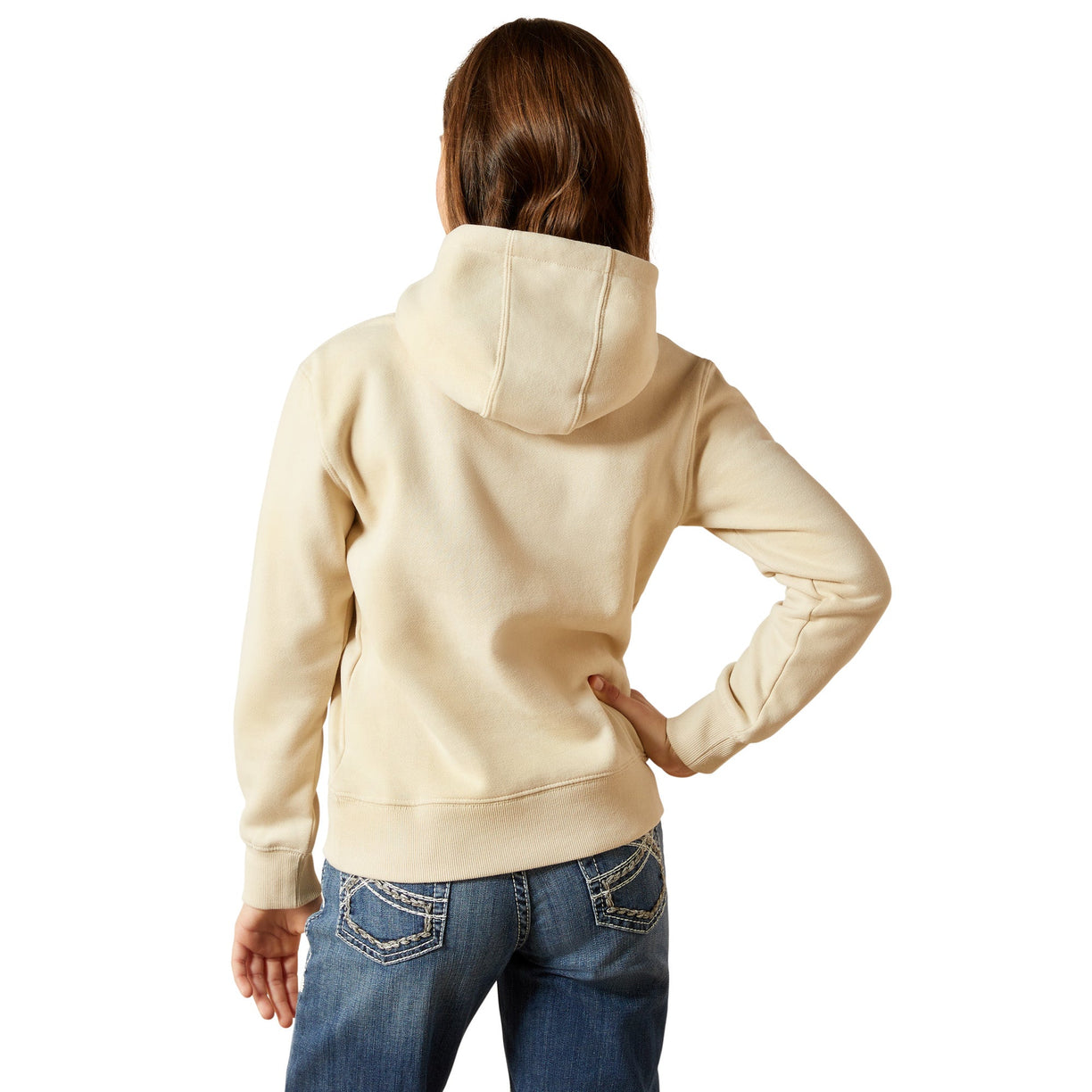 Person wearing a beige hoodie and blue jeans on a white background
