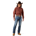 Person wearing a cowboy outfit with a red shirt, blue jeans, and brown boots on a white background