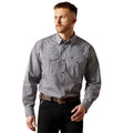 Man wearing a gray patterned button-up shirt and black pants on a white background